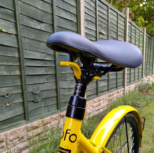 Dropper height adjust lever on yellow Ofo bike